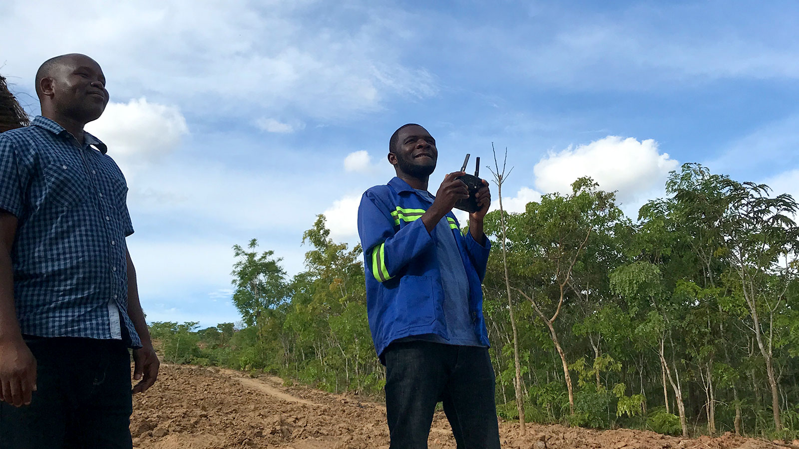 team learning how to fly the drone